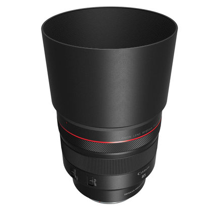 Top and side view of the Canon RF 85mm f/1.2L USM DS Lens with lens hood fitted, on a white background.