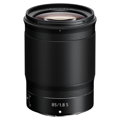 NIKKOR Z 85mm f/1.8 S Lens on a white background.