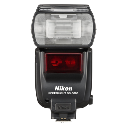 Front view of a Nikon Speedlight SB-5000 camera flash on a white background.